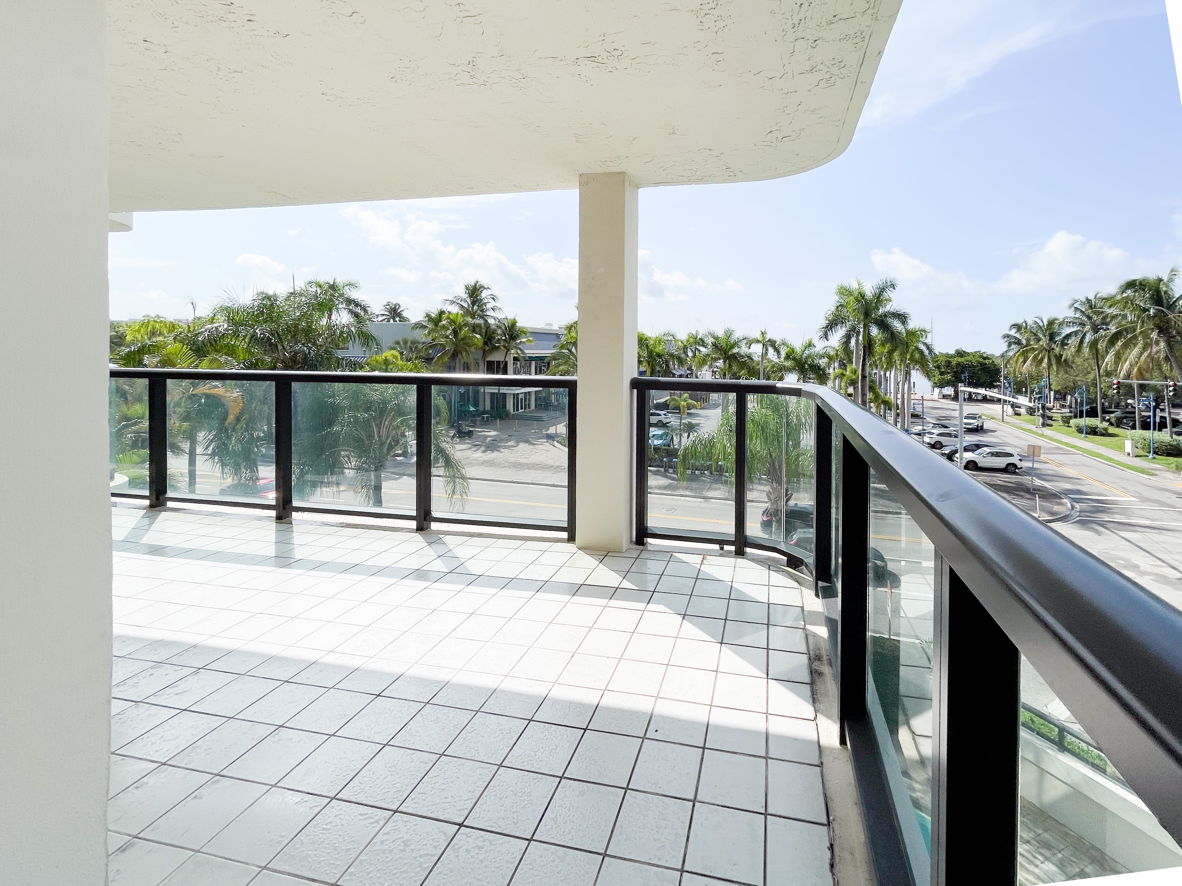 Open corner terrace with tropical street views